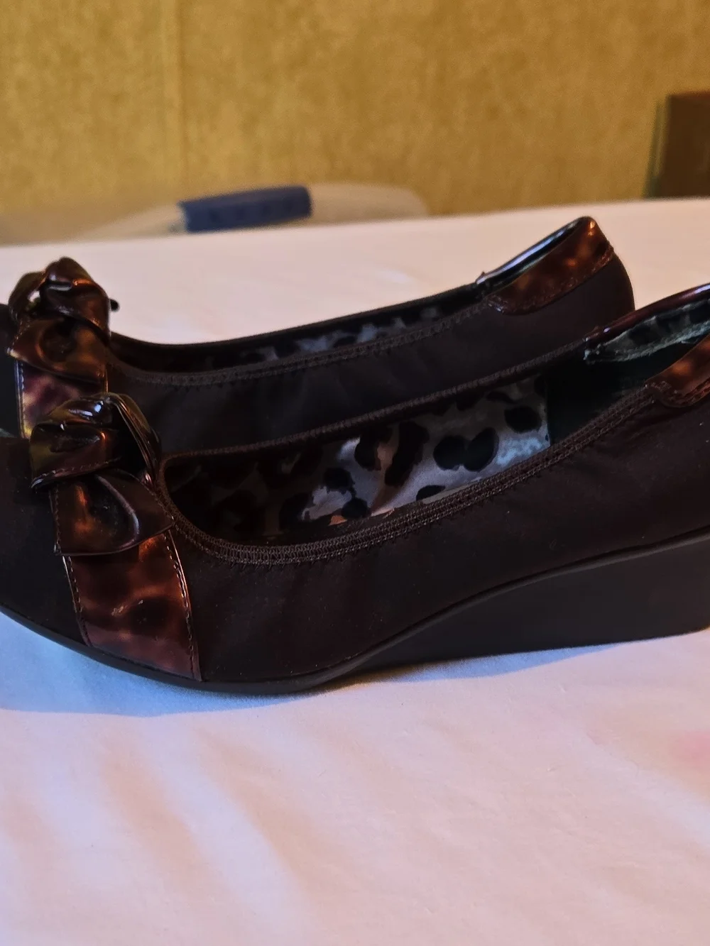 Anne Klein Black Wedge Flats with Glossy Bow Accent
